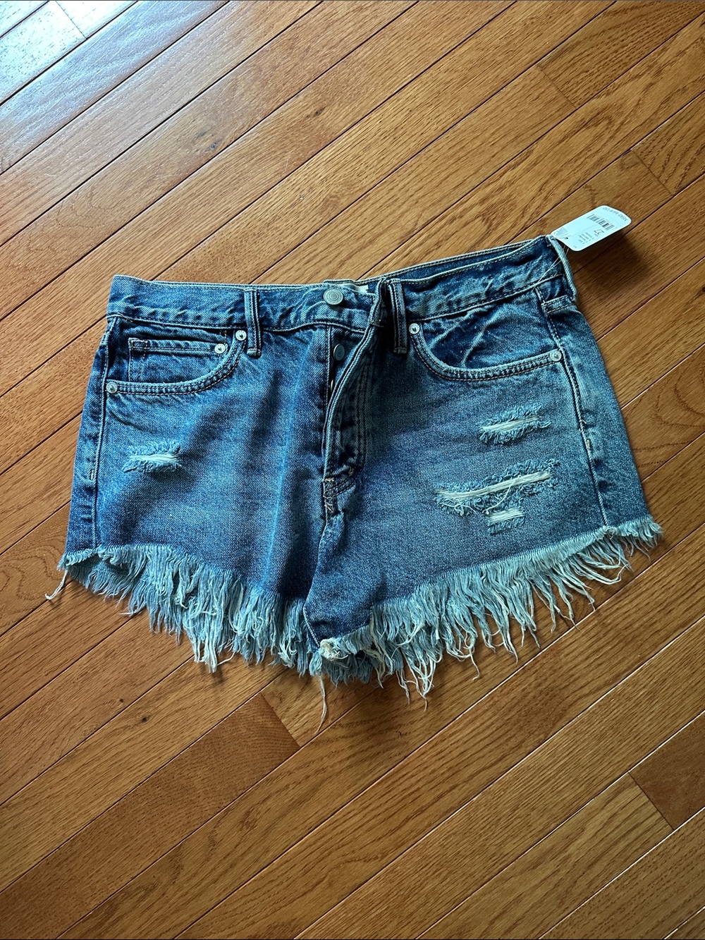 Women’s Distressed Blue Denim Fringe Hem Shorts